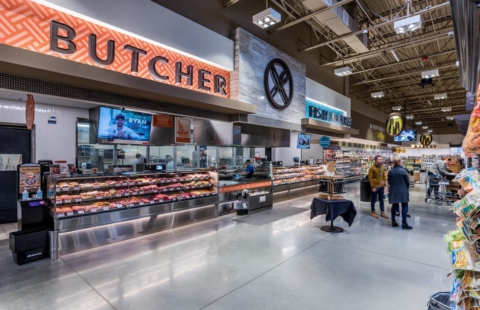 Large dimensional letters against bold patterns create the grocery store signage for "BUTCHER" AND "FISH MARKET"