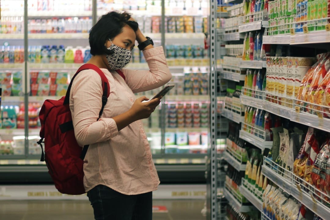 Woman Stressed While Grocery Shopping