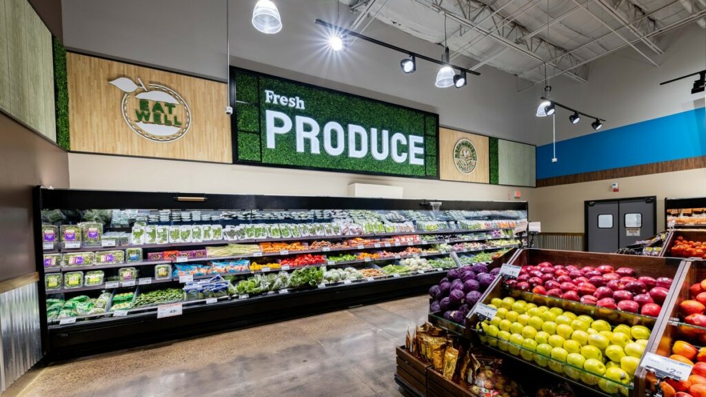 Simple and clean grocery store signage. "Fresh" in smaller white letters above "PRODUCE" against a green background.