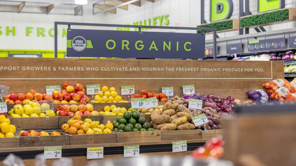 A grocery store's organic produce sign designed by supermarket designers