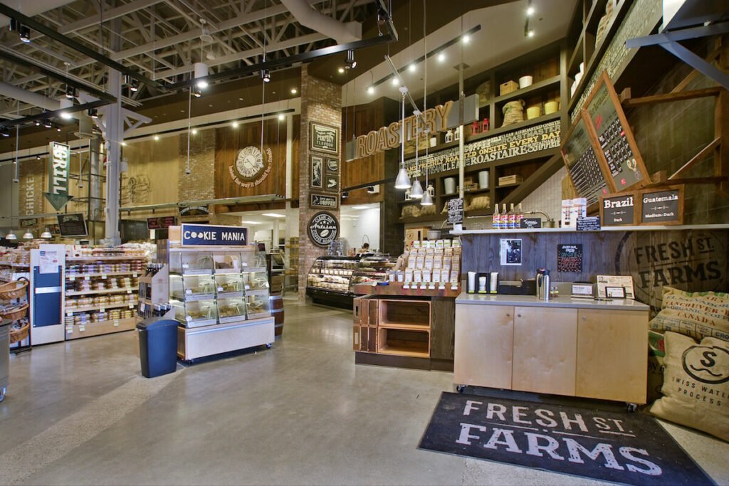 A supermarket with a large selection of products and prominent grocery store signage.