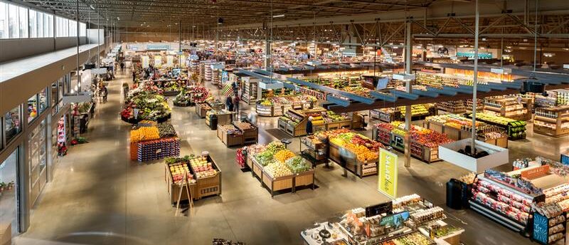 Grocery store interior featuring branded signage, custom fixtures, and strategic layout to support ROI-driven store planning